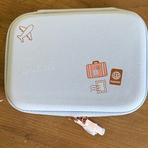 Travel Essentials MoNat Baby Blue Pouch with Rose Gold Accents.